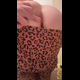 Miss Marilyn faces the camera in a leopard-print outfit in a bathroom, pulls it aside, and shows her ass. No pooping shown. Presented in 720P vertical HD format. About 3 minutes.